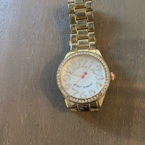 Betsy Johnson women’s watch in gold w/ crystals.